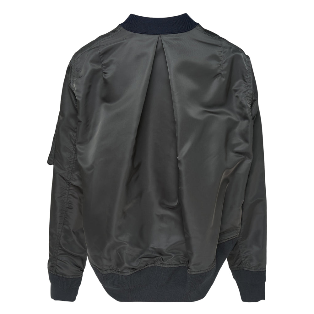sacai hybrid nylon twill and cotton knit cardigan in navy with grey bomber sleeves, orange lining, button front, and sleeve utility pockets