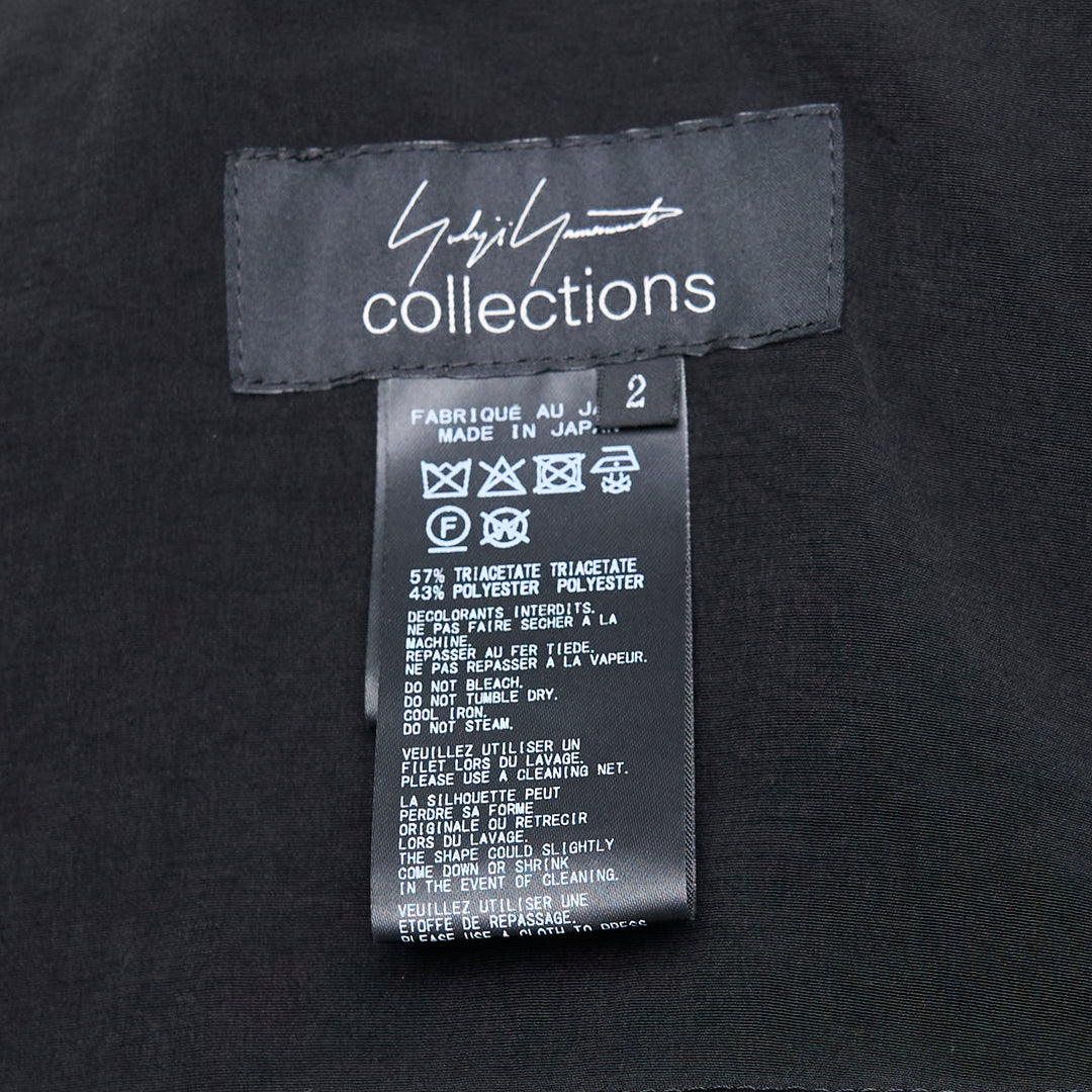 Yohji Yamamoto Stole Detail Single Jacket in black, featuring wide lapels, a single-button closure, an elongated stole panel at the front, and hip flap pockets