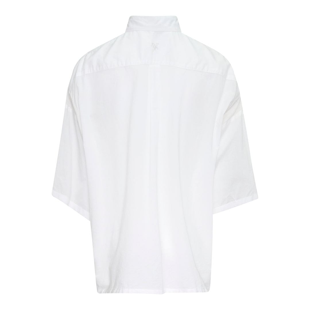 Y's oversized white half-sleeve blouse with dropped shoulders, wide billowing sleeves, point collar, and partial button placket, displayed on a plain white background