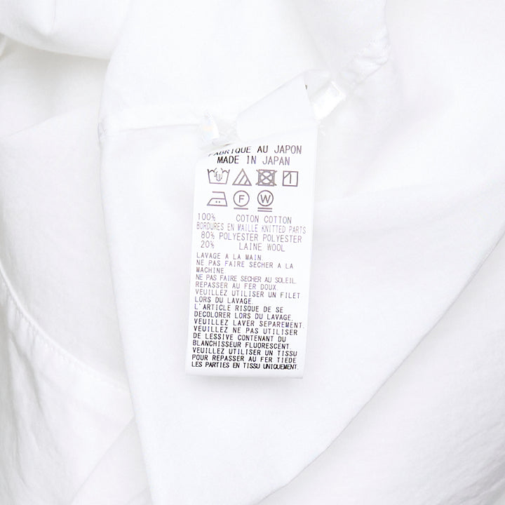Y's oversized white half-sleeve blouse with dropped shoulders, wide billowing sleeves, point collar, and partial button placket, displayed on a plain white background