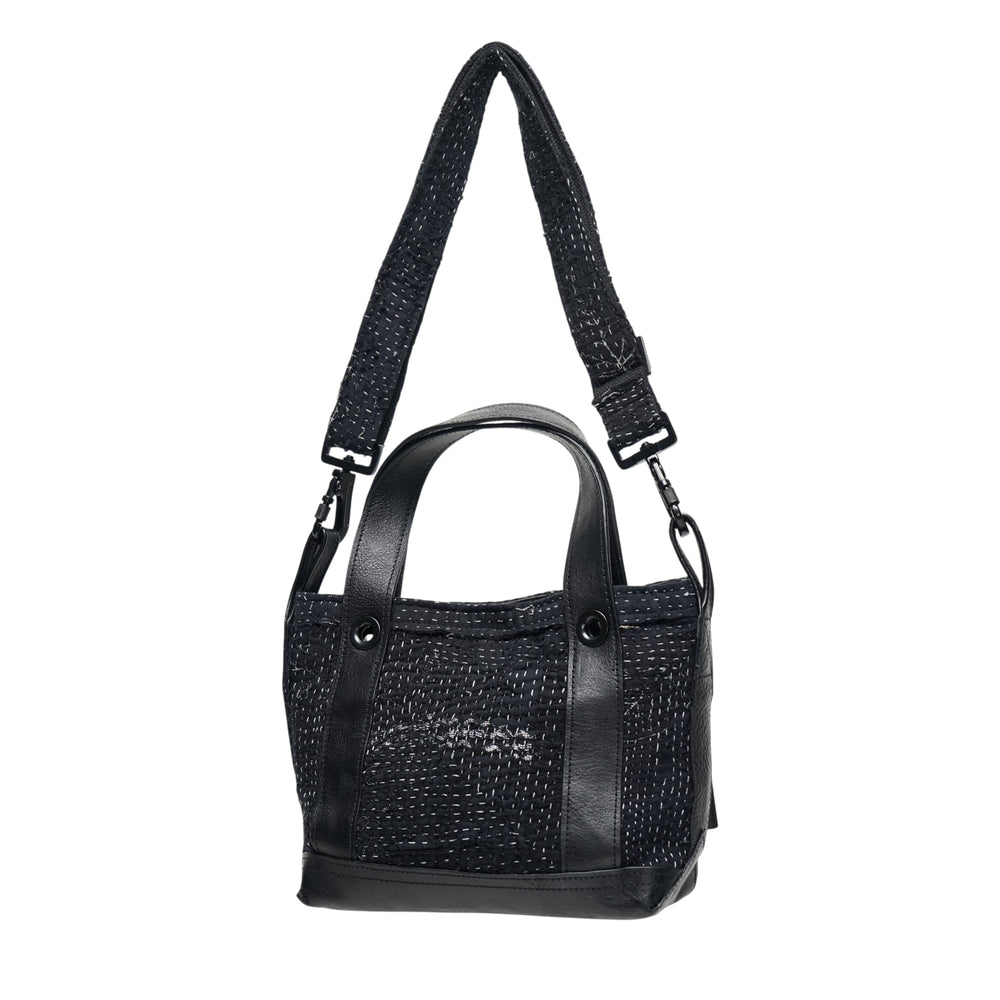 Y's x FAF 008 black kantha-stitched tote bag with pebbled leather trim, dual short handles, and a wide adjustable crossbody strap with gunmetal hardware - view 2