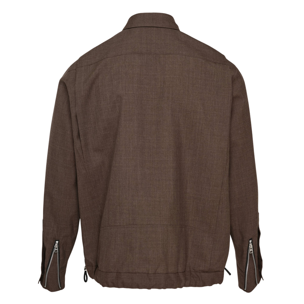 sacai Suiting Blouson in brown with zip and snap-button closure, angled chest zip pocket, dual zip hip pockets, flap snap pocket, and elasticated drawcord hem