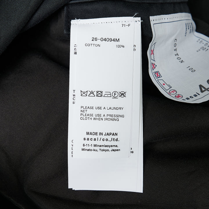 sacai Sueded Cotton Cargo Pants in washed black, featuring a balloon-leg silhouette, belted high waist, flap cargo pockets, and adjustable drawstring hems, photographed flat on a white background - view 3