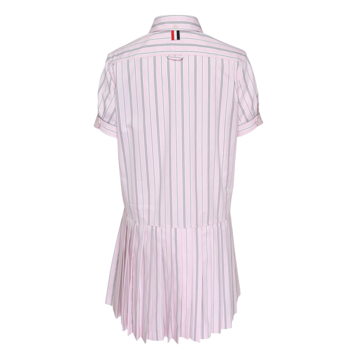 Thom Browne pleated bottom short sleeve shirt dress in pink and navy stripe with drop-waist silhouette and button-down collar, front view