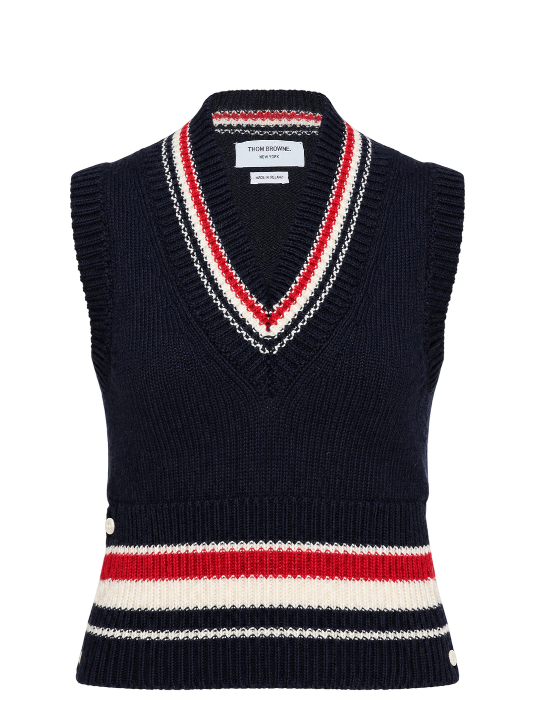 Thom Browne navy chunky-knit V-neck vest with red, white, and blue intarsia stripes at the neckline and hem and pearl buttons at the hem