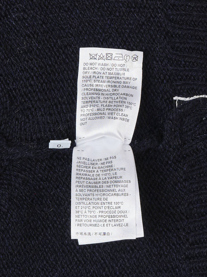 Thom Browne navy chunky-knit V-neck vest with red, white, and blue intarsia stripes at the neckline and hem and pearl buttons at the hem - view 4