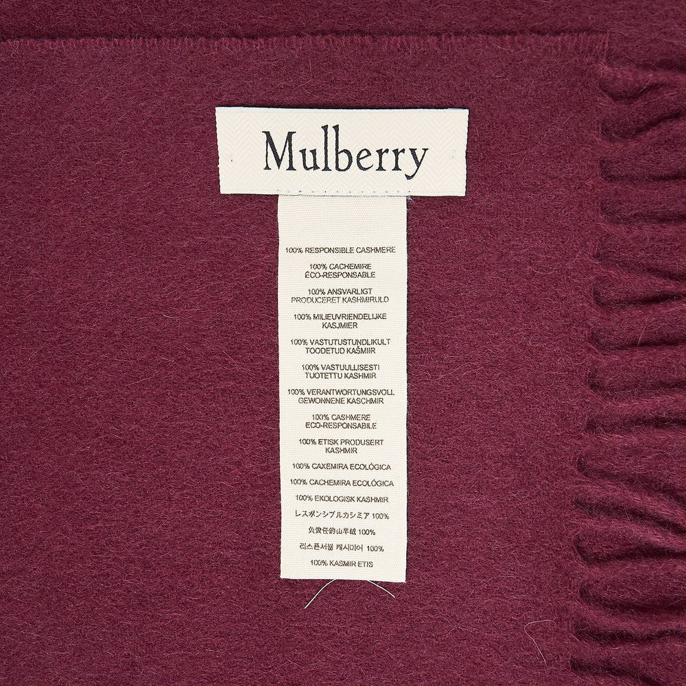 Mulberry navy cashmere scarf laid flat, 30 x 195cm, with fringe trim at both ends and tonal embroidered logo