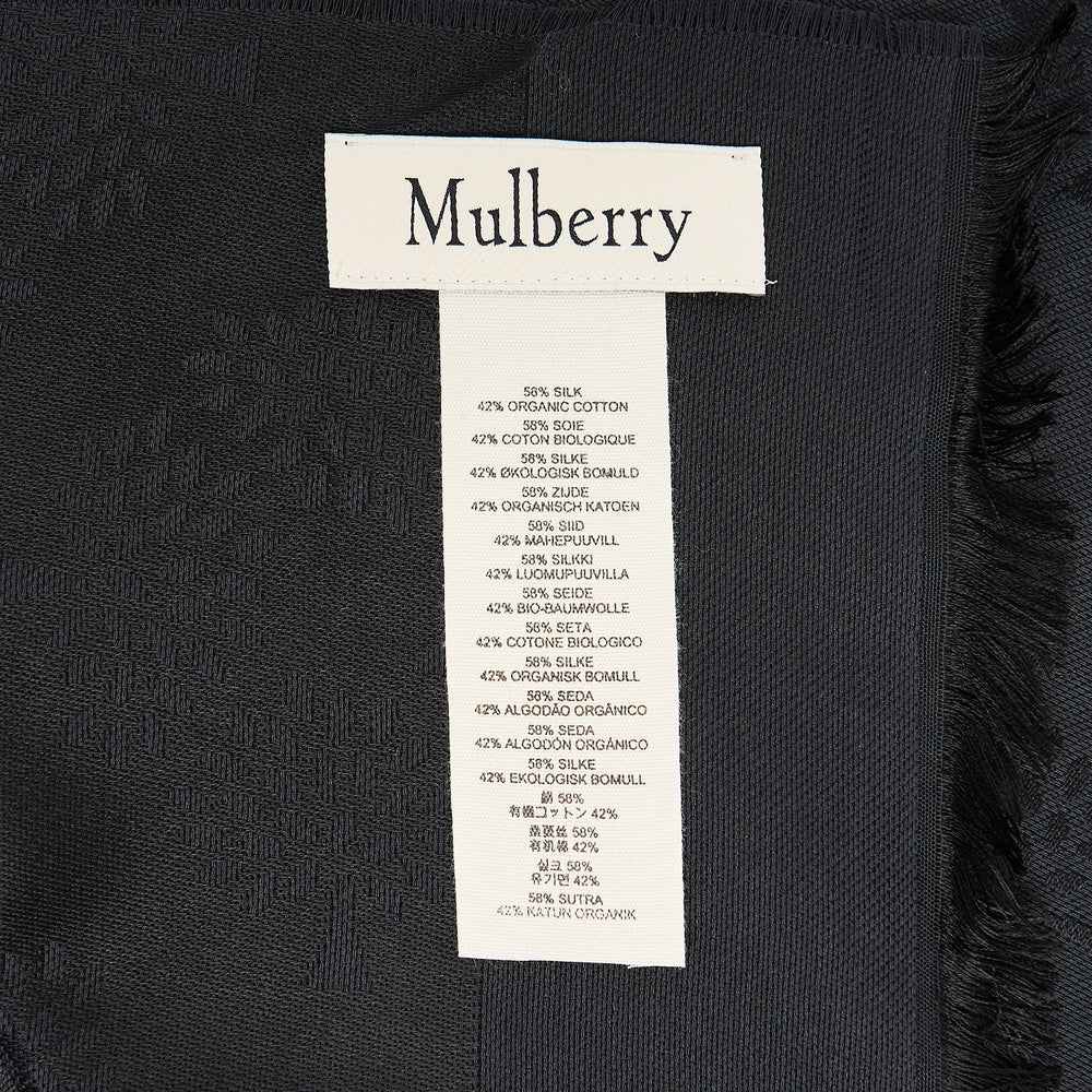 Mulberry Tree Rectangular Scarf in black, laid flat to show an all-over tonal jacquard tree motif, fringe hem trim, and Mulberry wordmark woven along the border