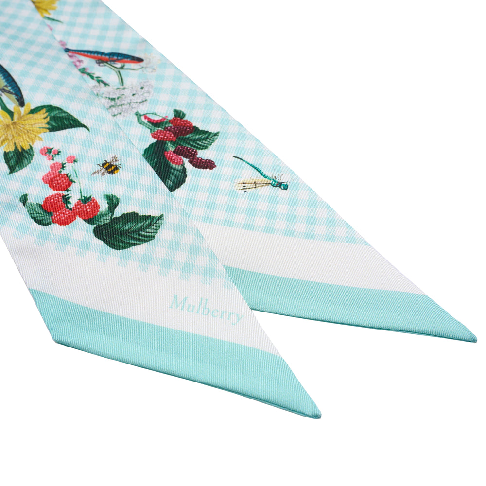 Mulberry Riverside Floral Skinny Scarf in blush pink gingham with botanical berry, wildflower, and insect illustrations, shown laid flat in a V-shape against a white background