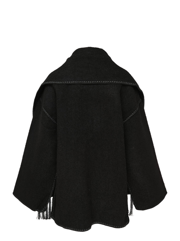 Toteme Embroidered Scarf Jacket in black wool with tonal whipstitch trim, snap-button placket, patch pocket, and long fringe tassel hem — flat lay on white background - view 2