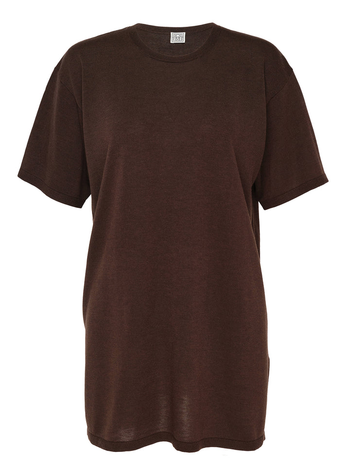 Totême Knit Short Sleeve Tee in chocolate brown, featuring an oversized silhouette, ribbed crew neck and cuffs, and elongated body
