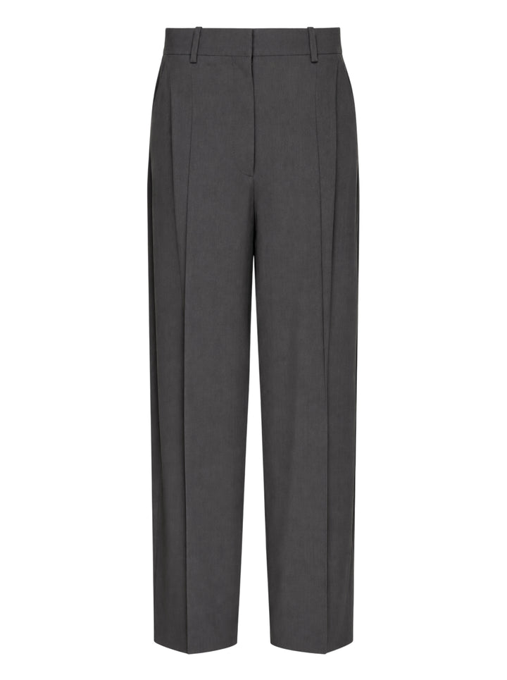 Totême High-Waist Pleated Trousers in charcoal grey, featuring front double pleats, a wide-to-tapered leg, and a structured high-rise waistband, shown flat on a white background