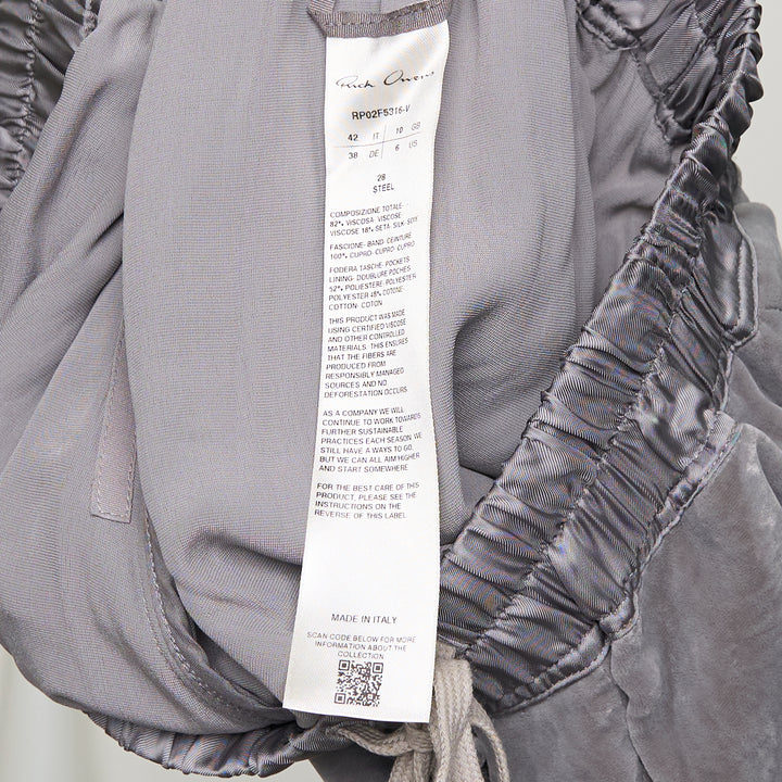 Rick Owens Fog Velvet Boxer Shorts in washed grey with elasticated drawstring waistband and contrast white underlayer at the hem, displayed on a white background