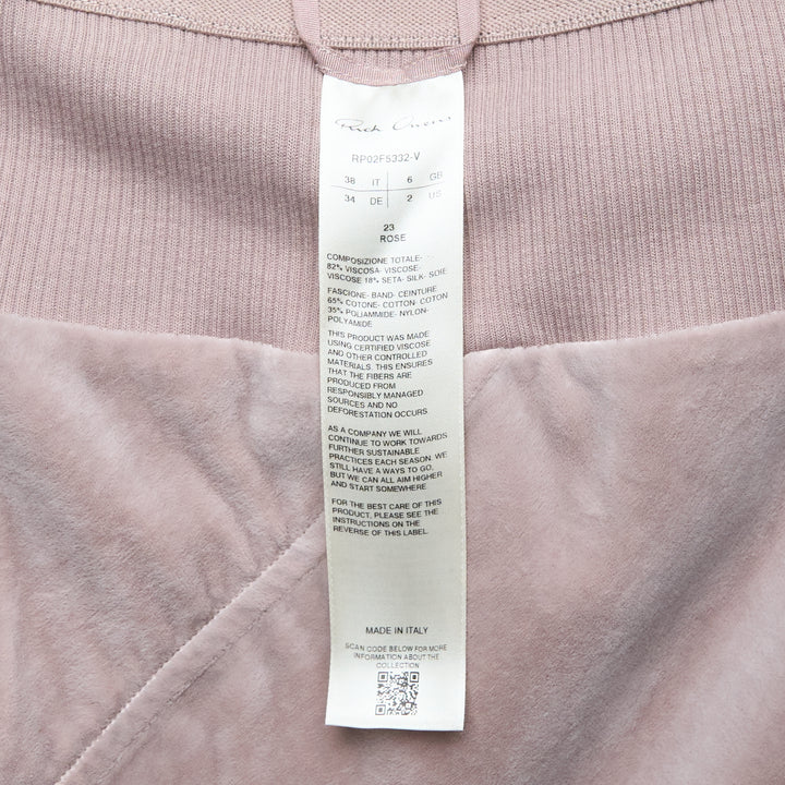 Rick Owens Knee Bias Velvet Skirt in dusty mauve, featuring a wide ribbed waistband, diagonal bias seam, and a fluid flared midi hem