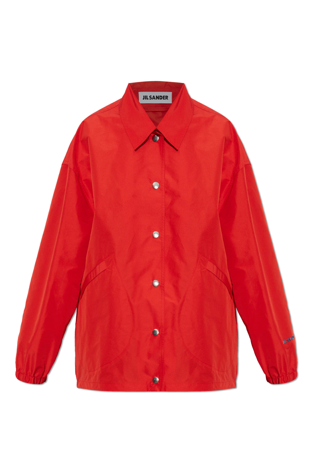 Jil Sander red technical coach jacket with pointed collar, silver snap-button front, curved pockets and elasticated cuffs