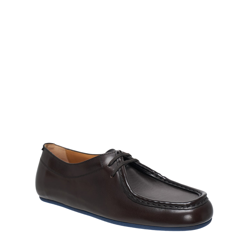 Jil Sander Hood lace-up flat in dark brown buffalo leather with moc-toe construction, tonal whipstitch detailing, and a contrasting navy rubber sole, side profile view