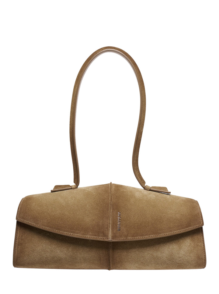 Jil Sander Linea soft suede shoulder bag in camel, featuring an angular structured silhouette, single flat top handle, fold-over flap closure, and tonal embossed logo