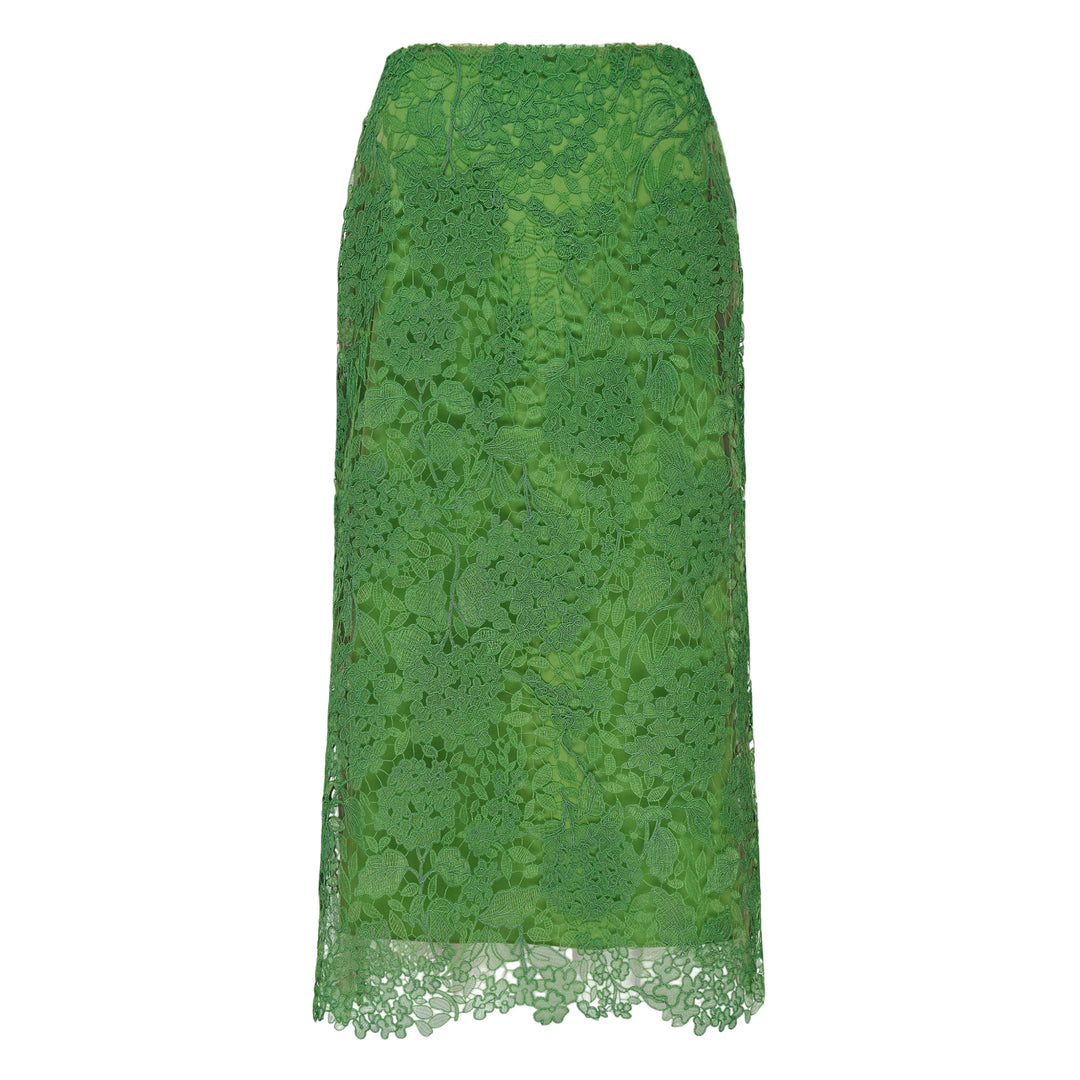 Carolina Herrera green floral guipure lace midi skirt with scalloped hem, pencil silhouette, and slip lining, shown flat against a white background