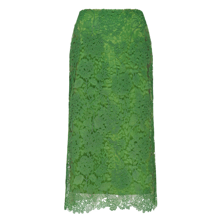 Carolina Herrera green floral guipure lace midi skirt with scalloped hem, pencil silhouette, and slip lining, shown flat against a white background