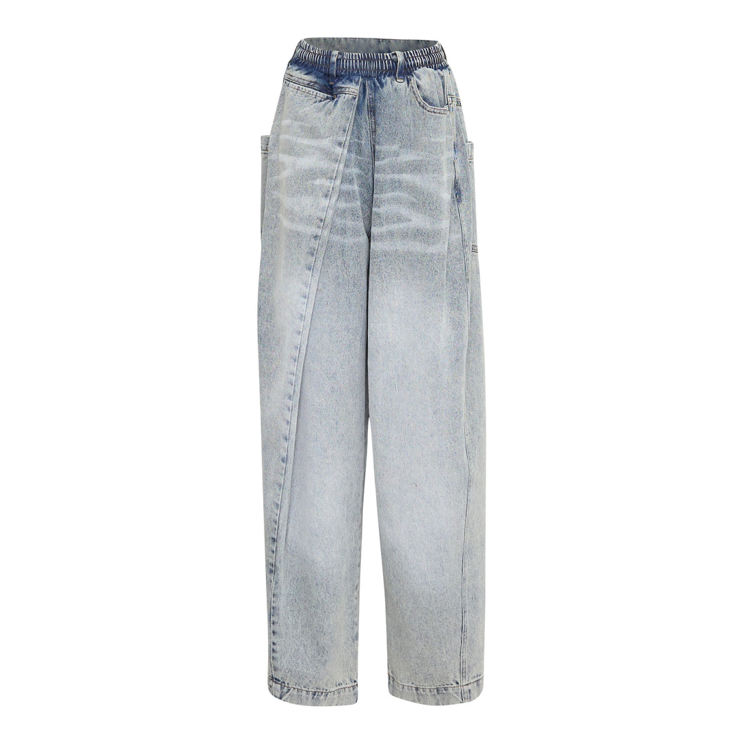 Bonbom Giant Front-Volume Tuck Jeans in light acid-wash denim, featuring sculptural front tuck pleats, a barrel-leg silhouette, and an elasticated waistband, styled flat on a white background