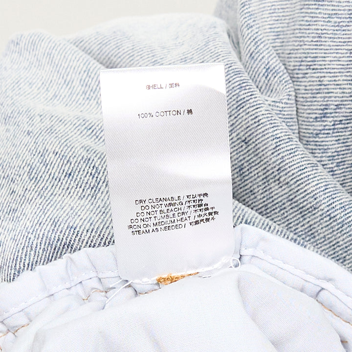 Bonbom Giant Front-Volume Tuck Jeans in light acid-wash denim, featuring sculptural front tuck pleats, a barrel-leg silhouette, and an elasticated waistband, styled flat on a white background