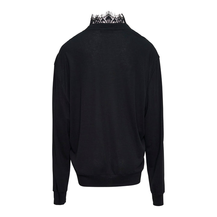 Bonbom Lingerie Neck Sweater in black, featuring a floral lace inset panel at the V-neck and a scallop-edged lace stand collar, with long sleeves and ribbed cuffs and hem