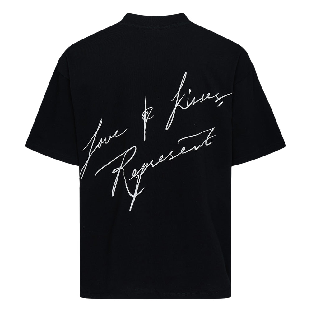Back view of Represent Love & Kisses Tee in black, featuring a white cursive script graphic reading 'Love & Kisses, Represent' across the back