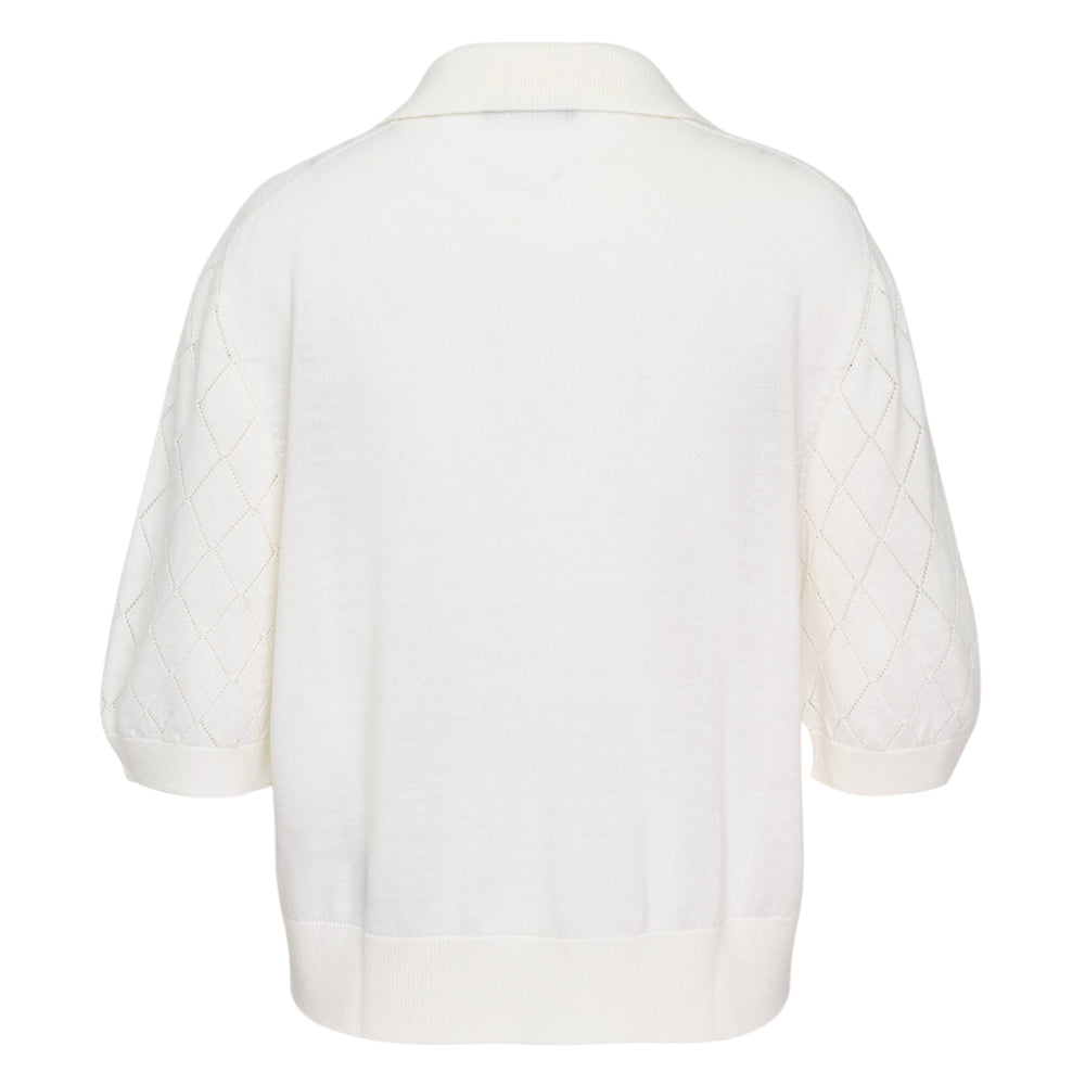 Balmain ivory lightweight wool knit polo with diamond pointelle puffed sleeves, three gold logo buttons, and a classic pointed collar