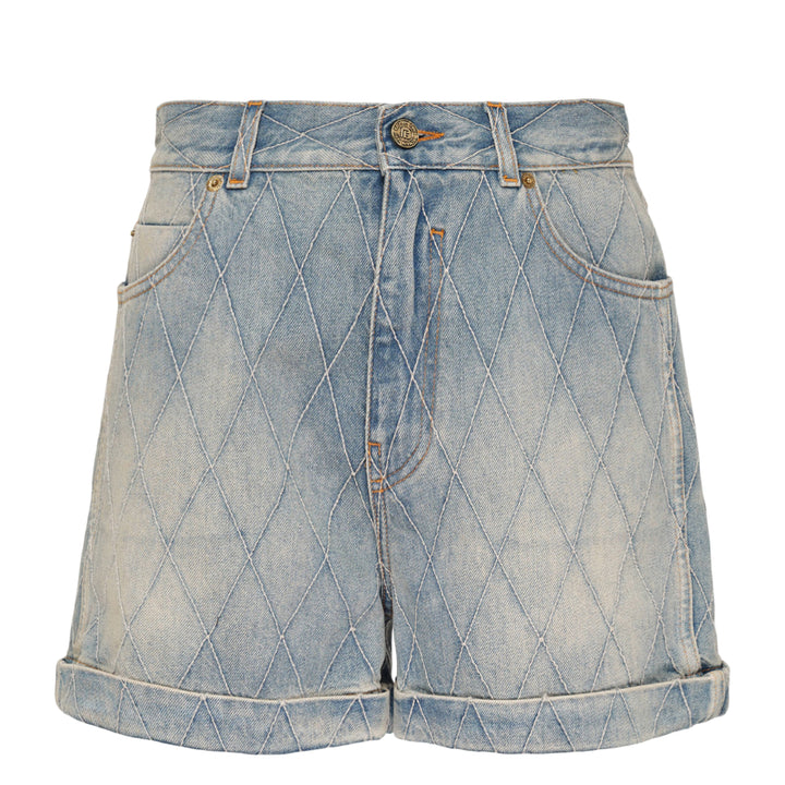 Balmain light blue acid-wash denim shorts with allover diamond quilted stitching, rolled cuffs, five-pocket design, and gold-tone logo button closure