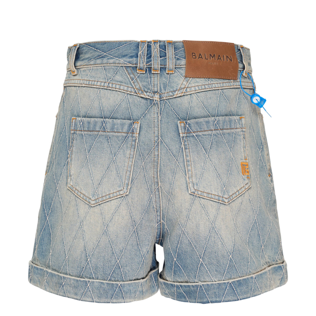 Balmain light blue acid-wash denim shorts with allover diamond quilted stitching, rolled cuffs, five-pocket design, and gold-tone logo button closure - view 2