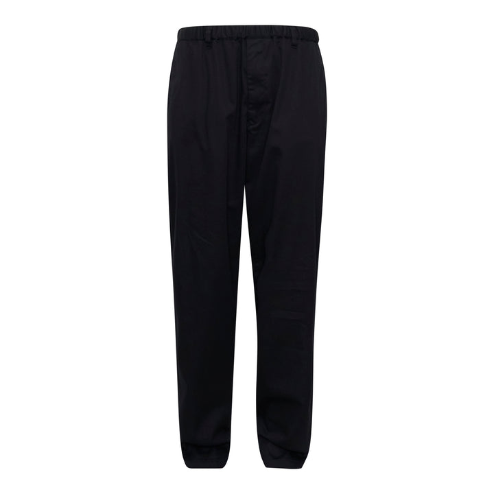 Undercover Elastic Waist Pants in black, featuring an elasticated waistband, front pleat, and tapered leg — front view on a flat lay