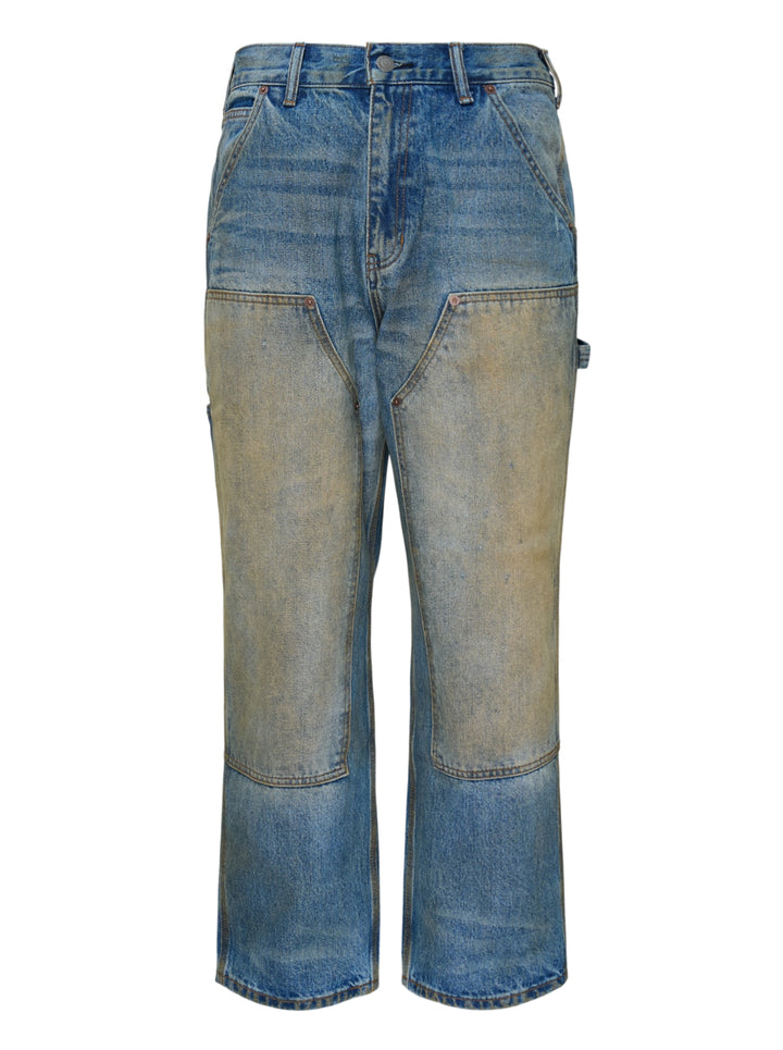 thisisneverthat Denim Double Knee Pants in heavy vintage wash indigo with ochre distressing, double-knee reinforced panels, carpenter utility detailing, and a relaxed wide-leg silhouette — front view