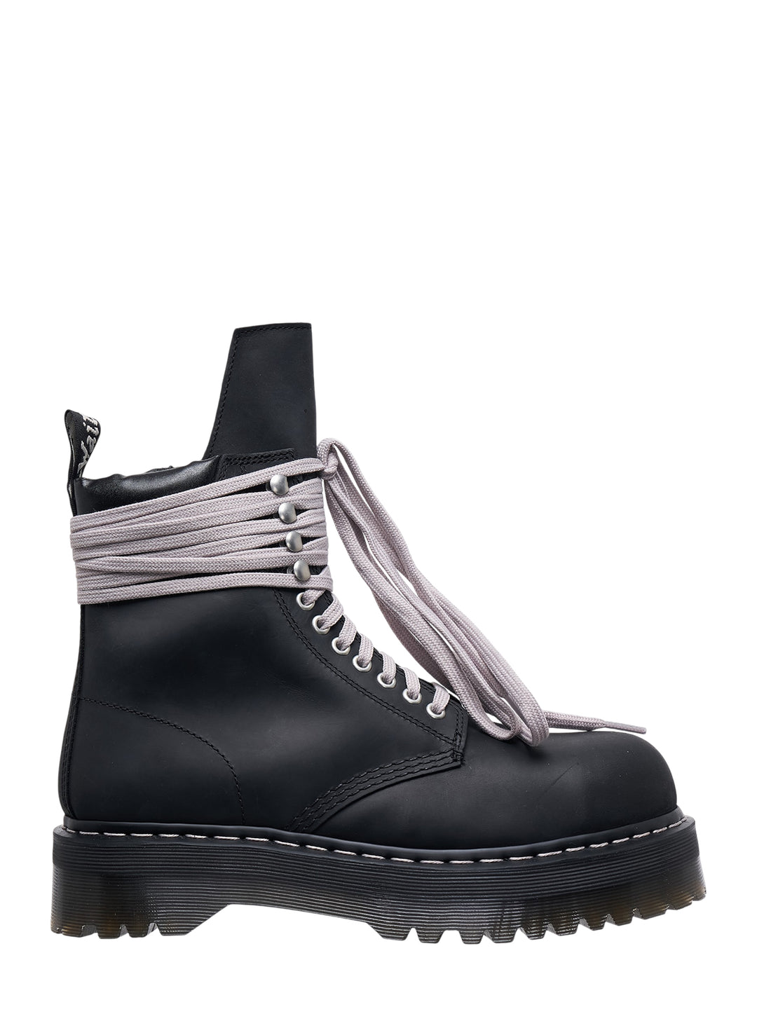 Rick Owens x Dr. Martens Quad Sole Steel Toe Boot in black leather with oversized pale lavender laces wrapped around the ankle and chunky ridged platform sole