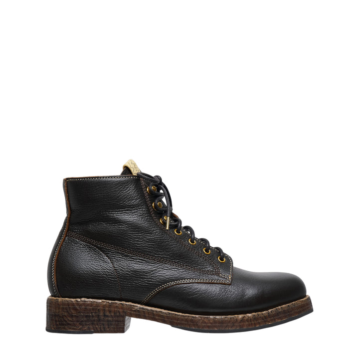 visvim Virgil Folk lace-up boot in black pebbled vegetable-tanned leather, featuring brass eyelets, contrast stitching, and a textured stacked leather sole, shown in profile