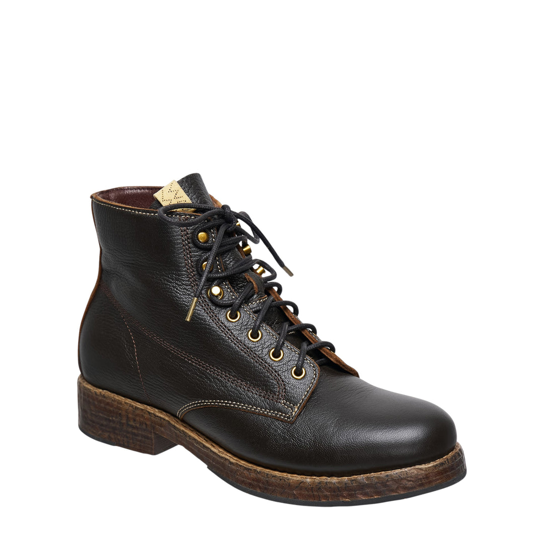 visvim Virgil Folk lace-up boot in black pebbled vegetable-tanned leather, featuring brass eyelets, contrast stitching, and a textured stacked leather sole, shown in profile - view 2