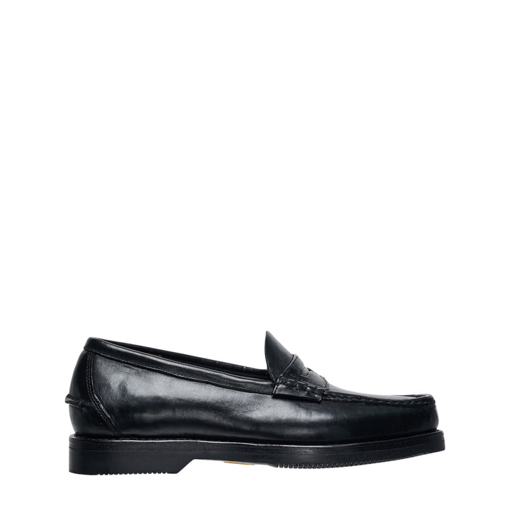 visvim FABRO-FOLK Italian vegetable-tanned black leather penny loafer, side profile view showing moc-toe stitching, penny strap, and rubber outsole