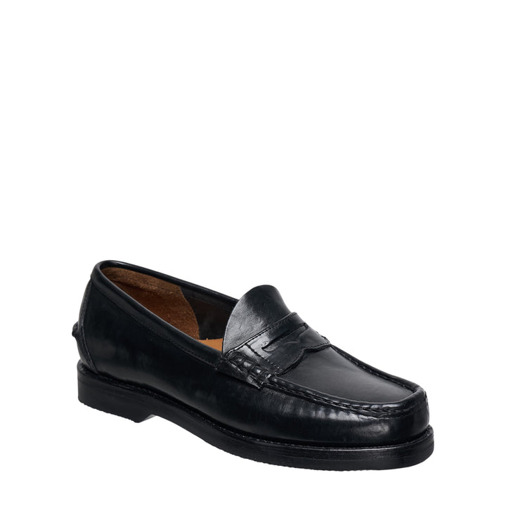 visvim FABRO-FOLK Italian vegetable-tanned black leather penny loafer, side profile view showing moc-toe stitching, penny strap, and rubber outsole - view 2