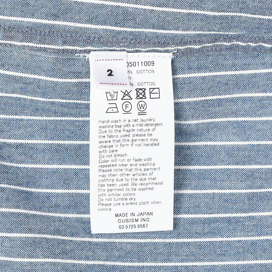 visvim Ingall Long Sleeve Shirt in blue chambray with white pinstripes, featuring a Mandarin band collar, cream button placket, and double-stripe cuff detailing - view 3