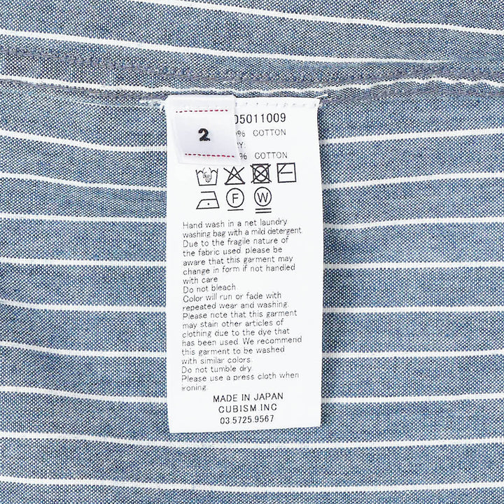 visvim Ingall Long Sleeve Shirt in blue chambray with white pinstripes, featuring a Mandarin band collar, cream button placket, and double-stripe cuff detailing - view 3