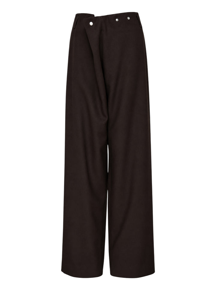 Dark brown wool crepe wide-leg Piega trousers by Niccolò Pasqualetti with an asymmetric folded waistband and metal snap fastenings