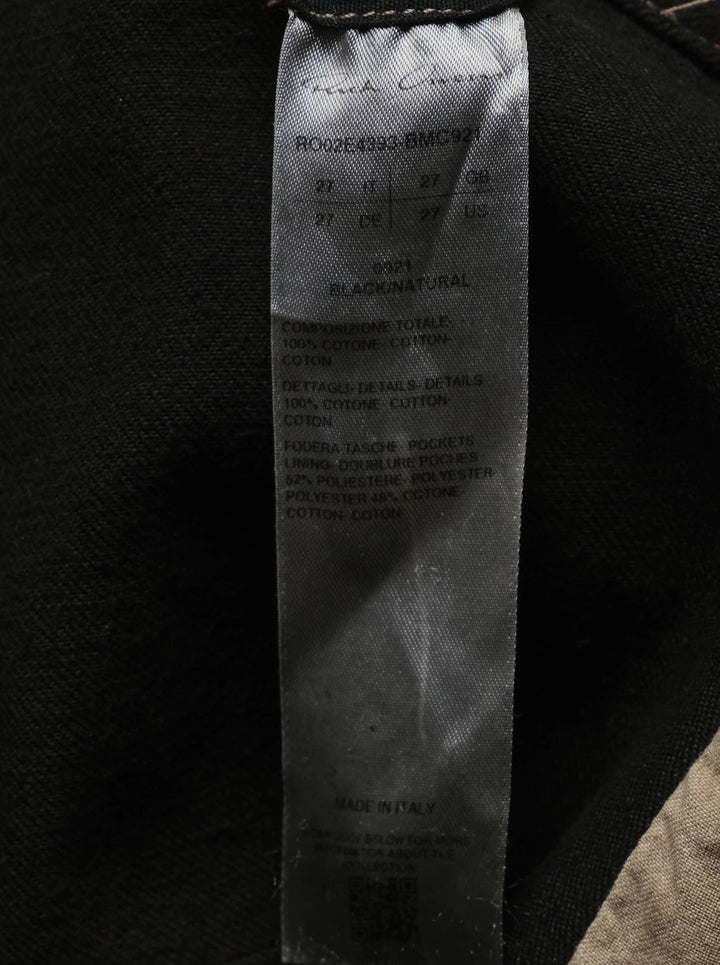 Rick Owens sliced denim skirt in coated black with beige underlayer panels and frayed raw edges - view 3