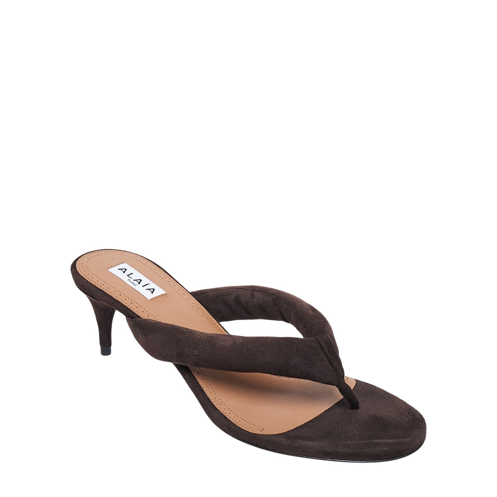 Alaïa Padded Suede Thong Heeled Sandals in dark espresso brown, featuring a padded strap, square open toe, and slender 55mm kitten heel, shown in profile view