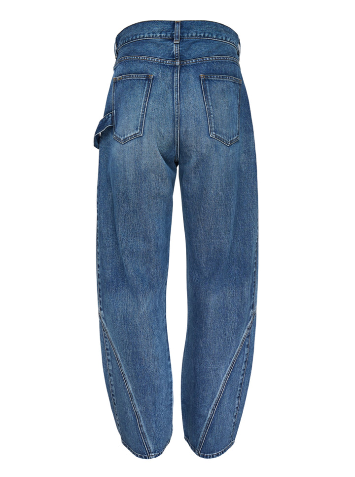 JW Anderson Twisted Workwear Jeans in washed blue denim with curved twisted seams, embroidered front pocket and leather logo patch at the waistband - view 3
