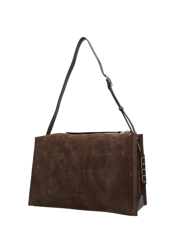 JW Anderson Messenger Loafer Bag in brown suede with adjustable dark leather crossbody strap, front slip pocket, and silver-tone bar hardware at both sides - view 2