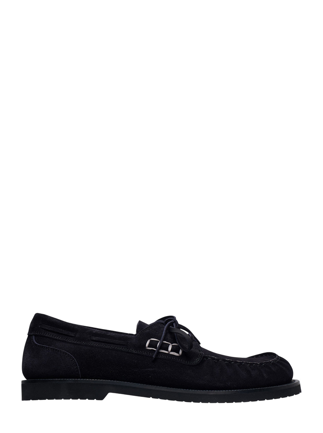 JW Anderson black suede boat loafer with lace-up vamp, silver ring hardware, and chunky ridged rubber outsole, shown in profile view