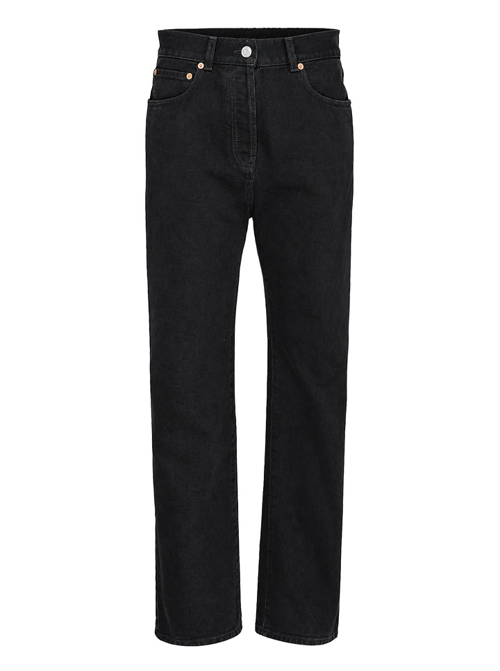 Balmain straight fit black denim jeans shown from the front with five-pocket styling, button closure and copper-tone rivets