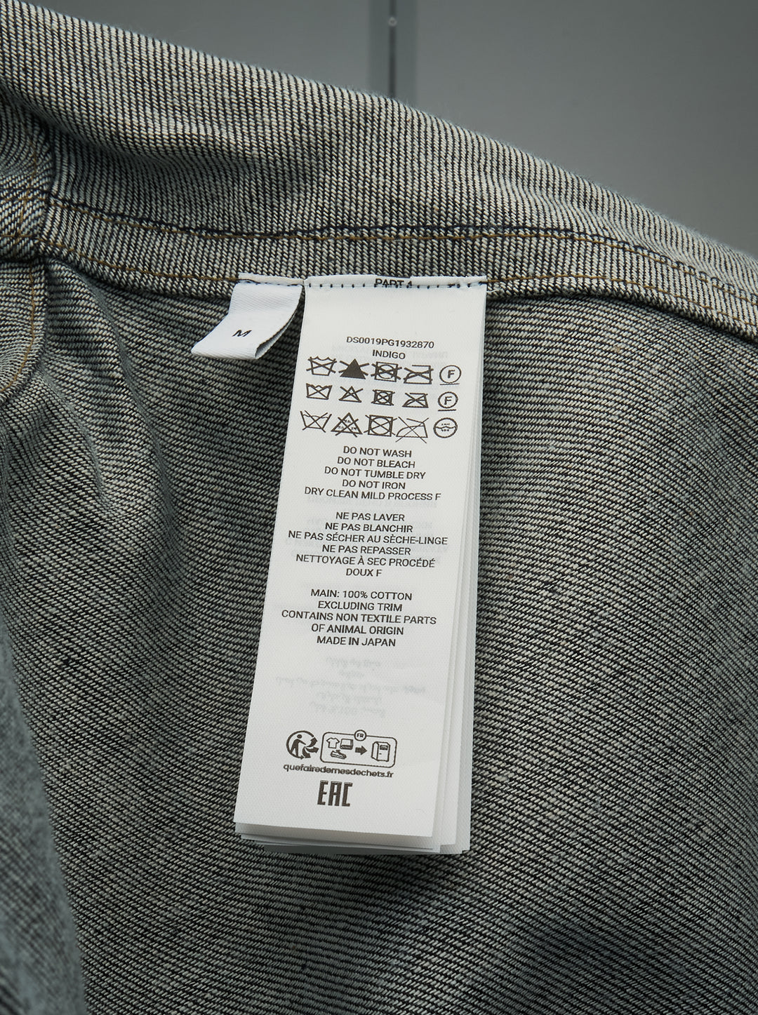 JW Anderson dark indigo lightweight denim flare hem shirt with detached dropped sleeves, cropped body, point collar, patch chest pocket, and mixed mother-of-pearl button fastening — front view - view 3