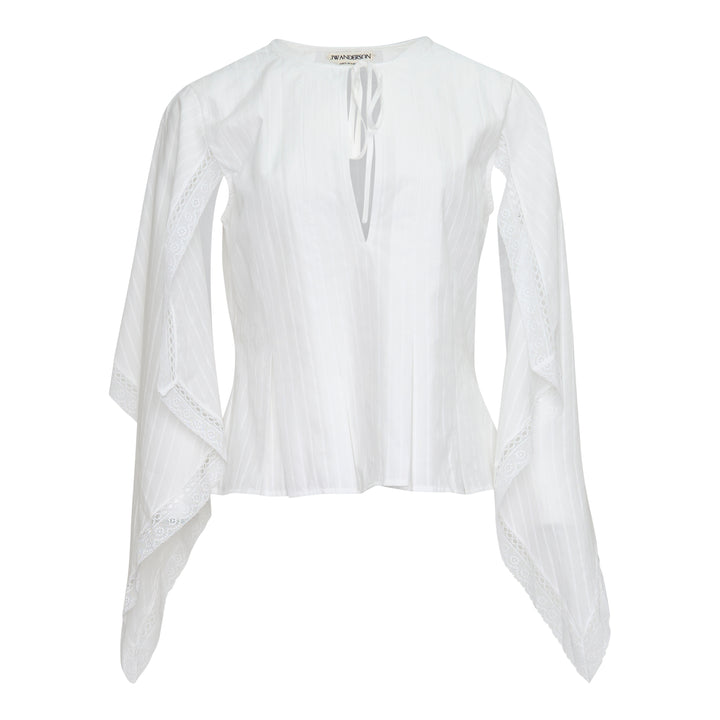 JW Anderson white woven top with dramatic draped handkerchief sleeves trimmed in broderie anglaise lace, fitted pintucked bodice, and a V-neckline with self-tie ribbon closure