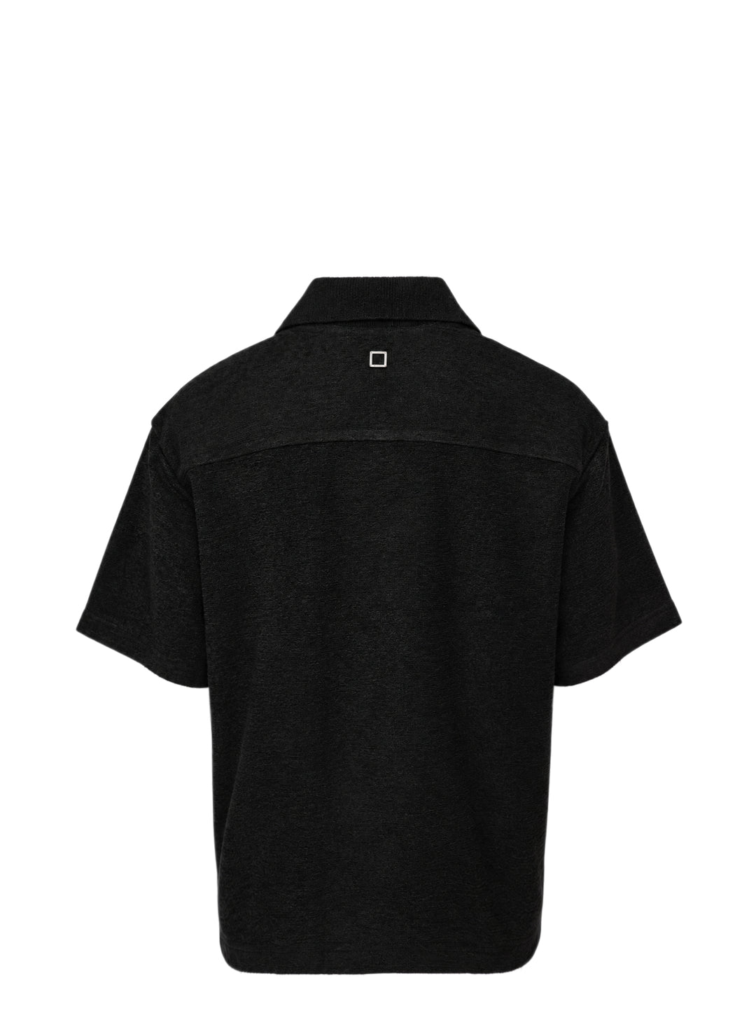 Wooyoungmi Oversized Textured Polo in black, featuring an open-placket collar, boxy short-sleeve silhouette, chest patch pocket with tonal WM monogram badge, and side hem vents - view 2