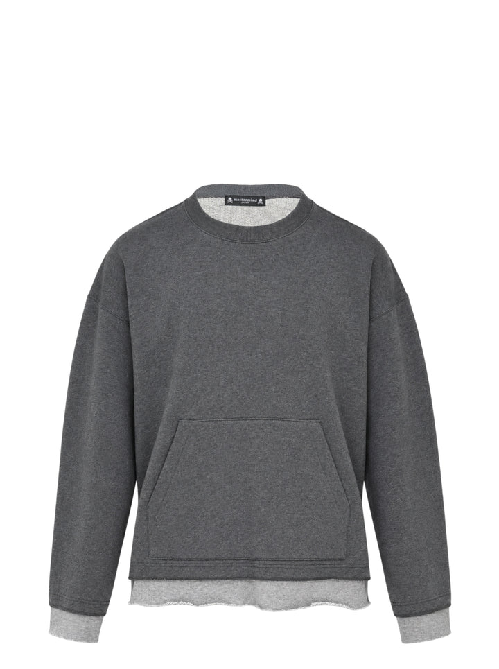 Mastermind Japan Cut-Off Boxy Crew Sweatshirt in charcoal grey with contrast raw-edge layered hem and cuffs, kangaroo pocket, and woven skull logo label at back neck